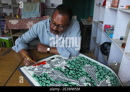 11 March 2020  Madhubani, Bihar, India.  Artist working on a Madhubani painting Stock Photo