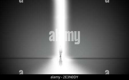 man passed the light doorway to freedom. abstract of a high grey wall with bright line of light. surreal dream concept Stock Photo