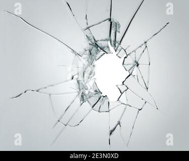 Broken window glass crack splitter on white gray background Stock Photo