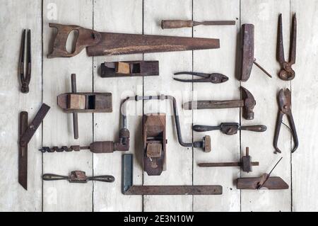 antique carpenter's tools on the wooden background of the woodwork Stock Photo