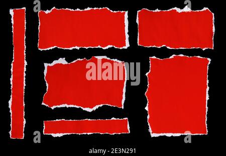 collection of red ripped pieces of paper on black background Stock Photo