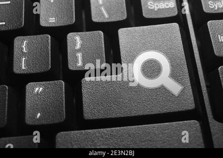 Closeup white search icon button on a keyboard Stock Photo