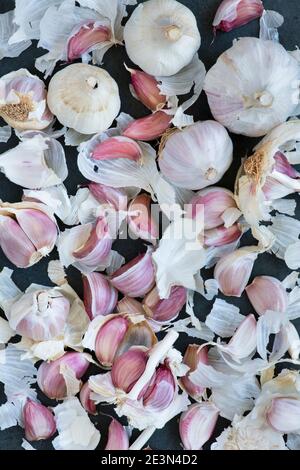 Garlic cloves on a slate background Stock Photo