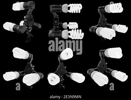 Lightbulbs in lamp holder on studio stand isolated on black background Stock Photo