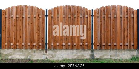 Long old yellow  solid  wooden rural fence from vertical planks. Isolated on white. Panoramic collage Stock Photo