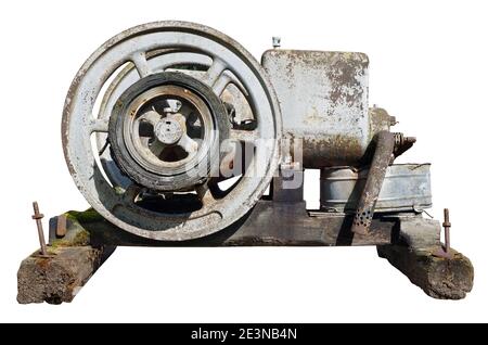 Rusty vintage small tractors diesel engine was painted white. Isolated Stock Photo