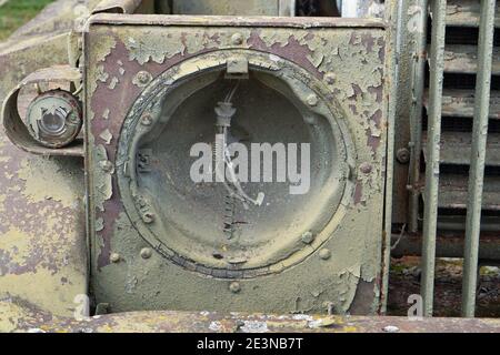 Broken glass spotlight on the rusty green  mosyy truck. Stock Photo