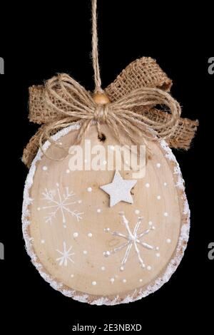 Homemade Christmas tree decoration ball  made of wood, plaster and glitters bowl. Isolated on black Stock Photo