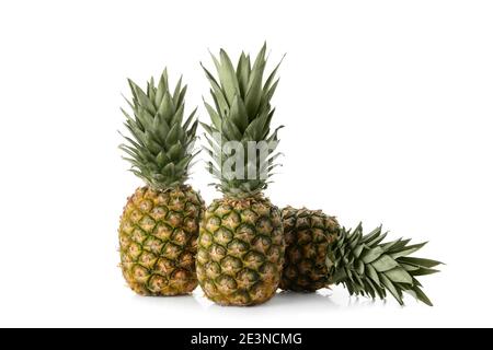 Tasty ripe pineapples isolated on white background Stock Photo