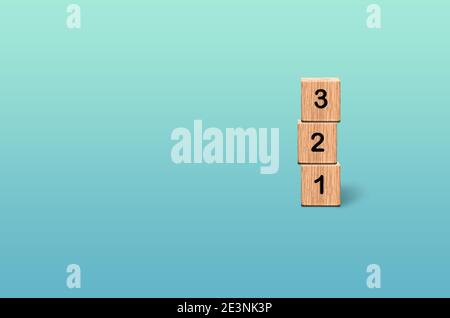 Wooden number blocks 1 2 3 on gradient blue turquoise background, count 123 rule concept Stock Photo