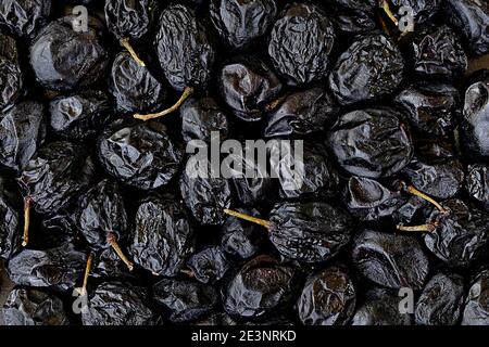 close-up topview photo of dried dark grapes as a background Stock Photo