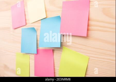 Colorful sticky notes with things to do on office board. Using task control of agile development methodology. Set of colorful sticky notes. Stock Photo