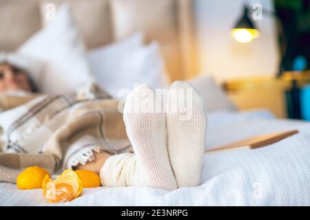 Close up picture of womans legs on a bed Stock Photo