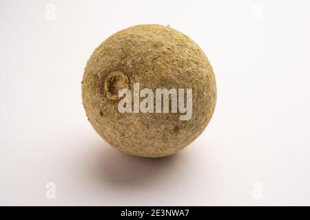 Wood apple or Kavath fruit, isolated over white background Stock Photo