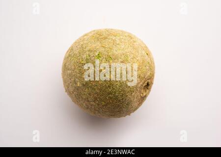 Wood apple or Kavath fruit, isolated over white background Stock Photo