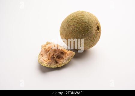 Wood apple or Kavath fruit, isolated over white background Stock Photo