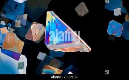 Poatassium chlorate crystals, cross polarized illumination, darkfield photomicrograph Stock Photo