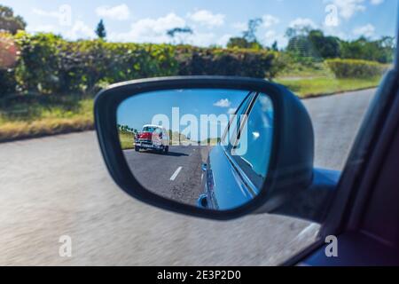 Vintage american car in the rear mirror
