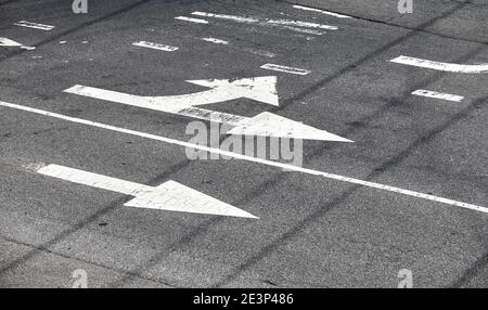 Road surface arrow markings on asphalt in New York City, USA. Stock Photo