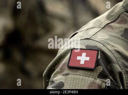 Flag of Switzerland on military uniform. Swiss flag on soldiers arm. Armed Forces, Army. Collage. Stock Photo