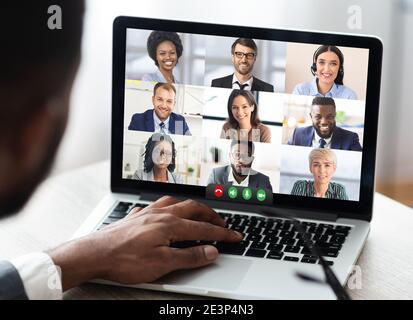 Businessman Having Business Meeting Making Video Call On Laptop Indoor Stock Photo