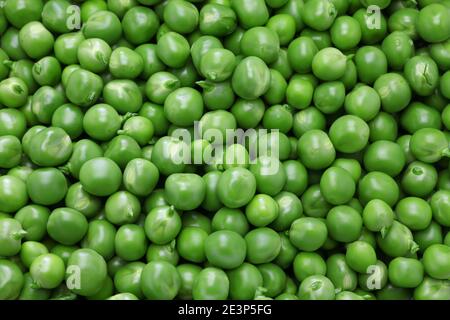 fresh organic green peas background Stock Photo