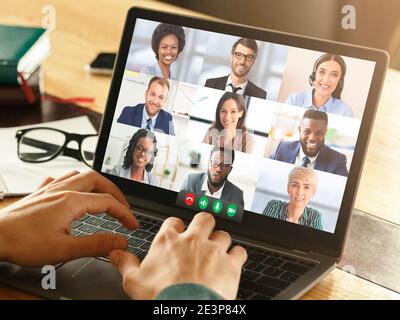 Coworkers Having Online Meeting Making Video Call On Laptop Indoor Stock Photo
