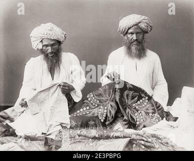 Vintage 19th century photograph: India, cloth, clothing, garments sellers with ornate shawls. Stock Photo