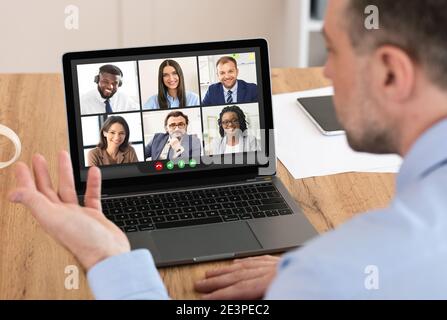Businessman Having Corporate Meeting Via Video Call On Laptop Indoors Stock Photo