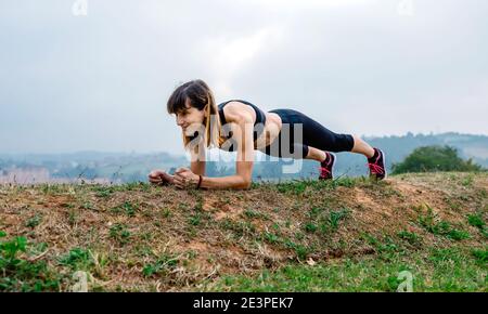Female athlete training doing plank Stock Photo