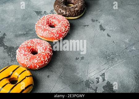 Delicious glazed donuts set, on gray background with copy space for text Stock Photo