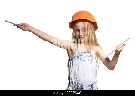Little Engineer, Little girl wearing the construction helmet,with tablet and a pen in the hands, isolated over white background. Stock Photo