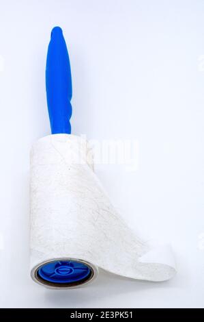 roller for cleaning clothes from wool, pet hair on clothes, Roller cleans clothes Stock Photo