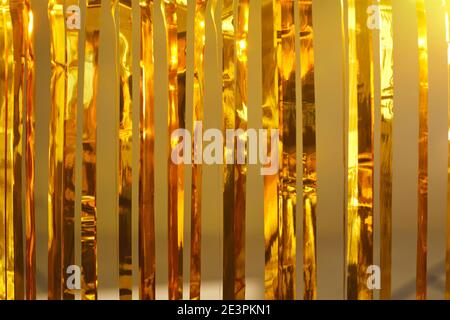 Festive background with closeup of golden foil fringe curtains at a party photo booth Stock Photo
