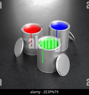 Paint pots with the RGB primary colors of the additive color model: Red, green, blue. Color stains on the pots, lids leaned to the pots. Stock Photo