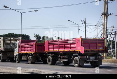 Chiangmai, Thailand -   November 30 2020:   Trailer Dump truck of Thanachai Company. On road no.1001, 8 km from Chiangmai city. Stock Photo