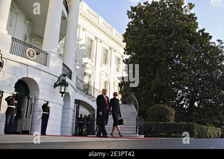 Washington, United States. 20th Jan, 2021. U.S. President Donald Trump, center left, and U.S. First Lady Melania Trump exit the White House before boarding Marine One on the South Lawn in Washington, DC, U.S., on Wednesday, Jan. 20, 2021. Trump departs Washington with Americans more politically divided and more likely to be out of work than when he arrived, while awaiting trial for his second impeachment - an ignominious end to one of the most turbulent presidencies in American history. Photo by Al Drago/Pool/ABACAPRESS.COM Credit: Abaca Press/Alamy Live News Stock Photo