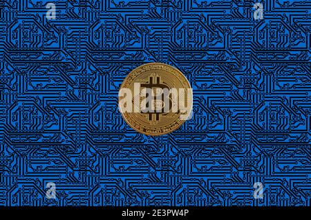 bitcoin coin on a circuit board background. Cryptocurrency Stock Photo