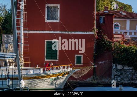 Man working on his boat, Picturesque small harbour in Fosha Bay, Zadar, Dalmatia, Croatia Stock Photo