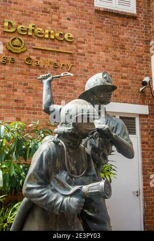 the fireman statue outside of Civil Defence Heritage Gallery (CDHG). This building used to be Central Fire Station, the oldest existing in Singapore. Stock Photo