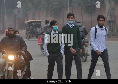 Lahore, Pakistan. 18th Jan, 2021. Pakistani students wearing facemasks to attend their first day of school with SOP's, at govt kinnaird high school in Lahore. Pakistani government reopened educational institutes across the country from grade 9th to 12th after remaining closed as a preventive measure against the Covid-19 coronavirus. (Photo by Rana Sajid Hussain/Pacific Press/Sipa USA) Credit: Sipa USA/Alamy Live News Stock Photo