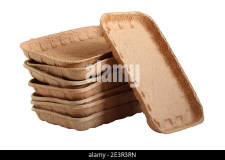 Biodegradable food trays made from pressed cardboard isolated on white background. Closeup Stock Photo