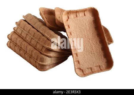 Biodegradable food trays made from pressed cardboard isolated on white background. Closeup Stock Photo
