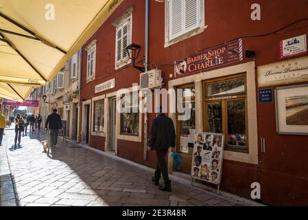 People walking on Narrow, pedestrian street with small shops, Zadar, Dalmatia, Croatia Stock Photo