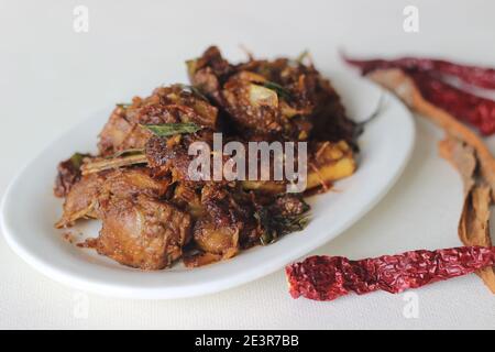 Spicy mutton roast prepared in Kerala style for special occasions like Christmas, Easter, Onam and other festivals Stock Photo