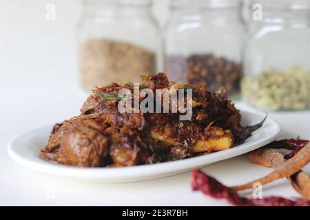 Spicy mutton roast prepared in Kerala style for special occasions like Christmas, Easter, Onam and other festivals Stock Photo