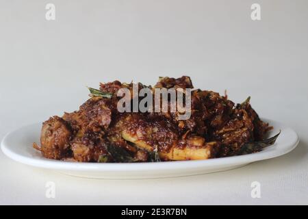 Spicy mutton roast prepared in Kerala style for special occasions like Christmas, Easter, Onam and other festivals Stock Photo