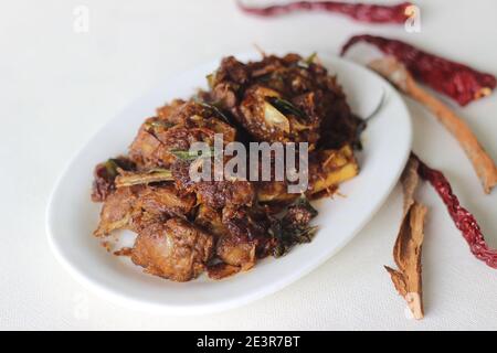 Spicy mutton roast prepared in Kerala style for special occasions like Christmas, Easter, Onam and other festivals Stock Photo