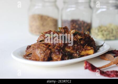 Spicy mutton roast prepared in Kerala style for special occasions like Christmas, Easter, Onam and other festivals Stock Photo