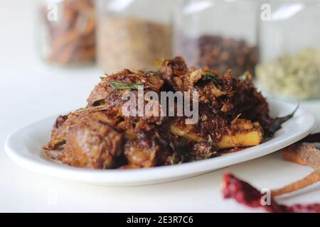 Spicy mutton roast prepared in Kerala style for special occasions like Christmas, Easter, Onam and other festivals Stock Photo